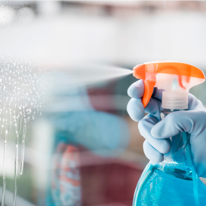 Cleaning a window with a spray bottle